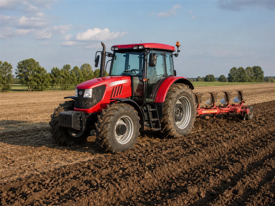 Illustrative utility tractor working in a field
